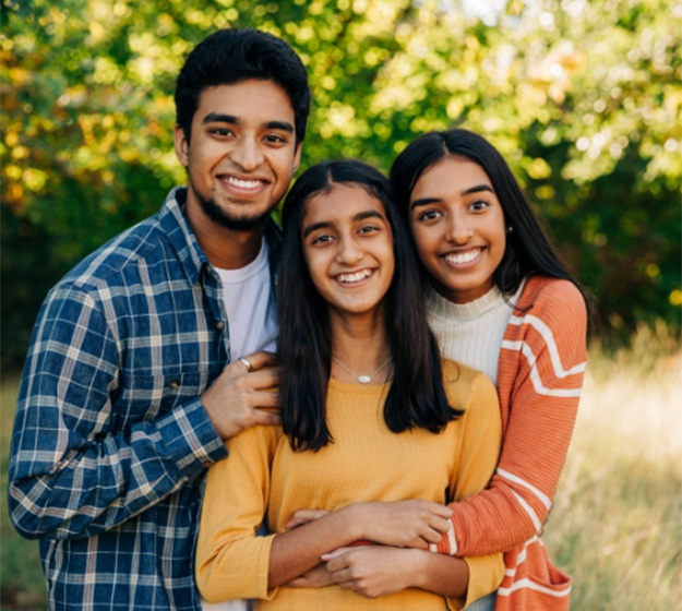 Happy patient learning about the cost of self-ligating braces