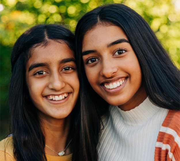 Orthodontist in Richardson checking patient’s smile