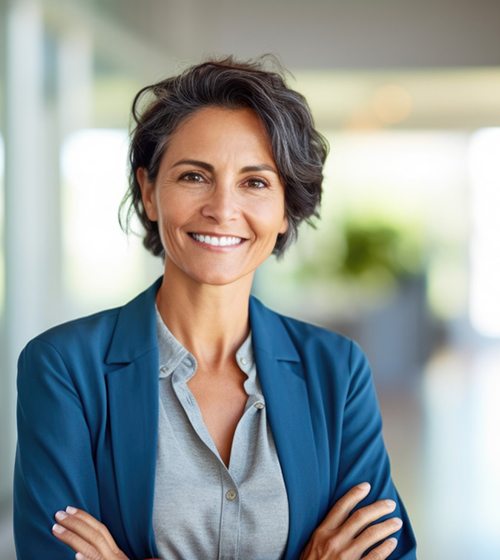 Mature business woman with beautiful smile after using Invisalign for adults