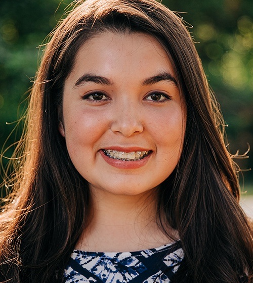 Young woman with clear and ceramic braces