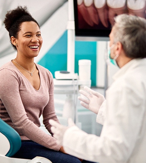Woman talking to orthodontist in Richardson