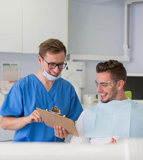 Patient and dental team member conversing