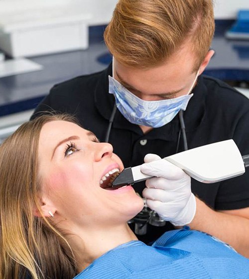 Patient getting her teeth scanned