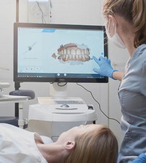 Three women smiling after Invisalign treatment