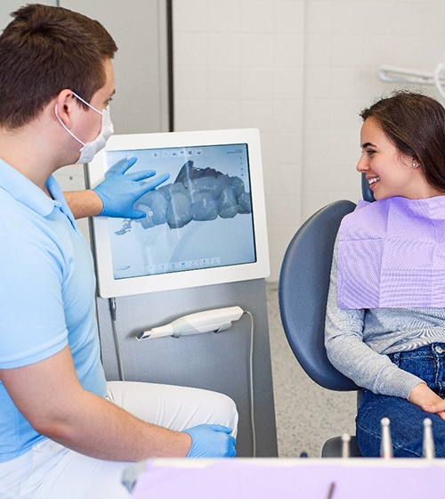 Patient looking at images from iTero scanner in Richardson