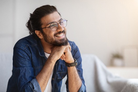 Man smiling with braces