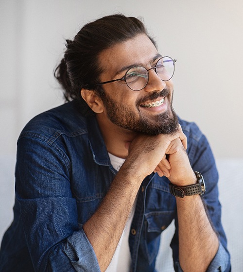 Man smiling with braces