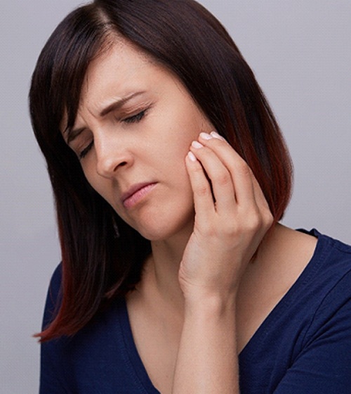 Woman with aching jaw needs orthodontics to address TMD