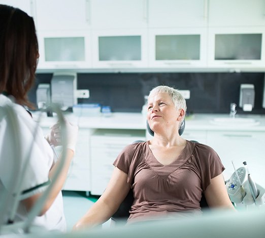 Adult patient learning about orthodontic treatment options