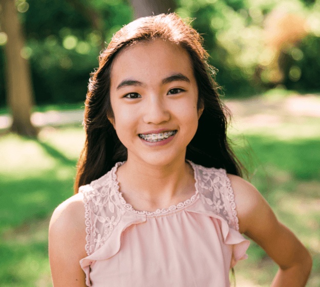 Teen girl with self-ligating braces