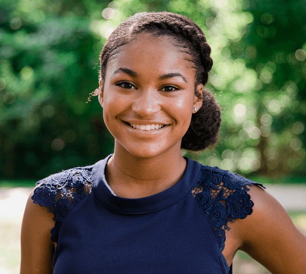 Teen girl with retainer smiling