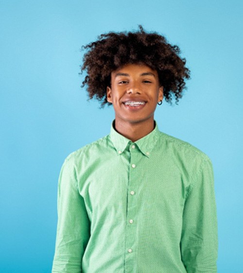 Adult woman showing off beautiful smile after orthodontics