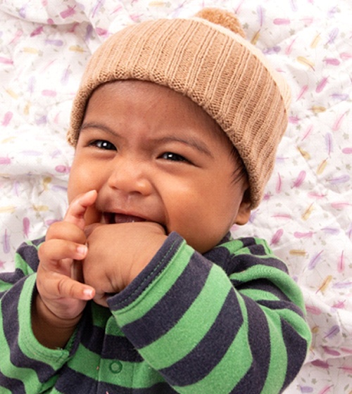 a baby sucking on their thumb