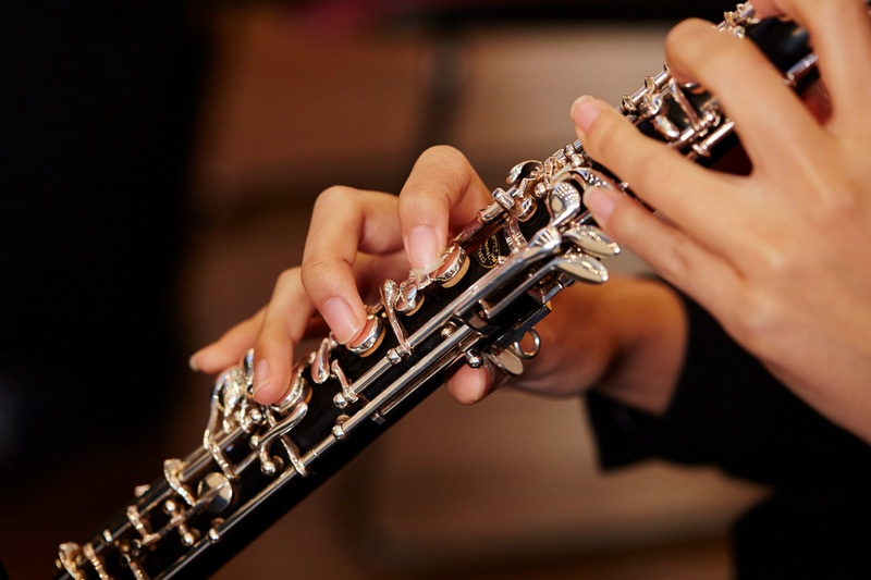 Patient playing an instrument with braces