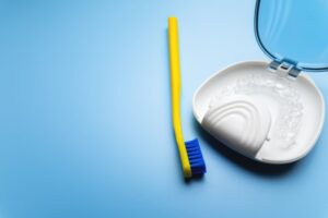 toothbrush and Invisalign case with aligners